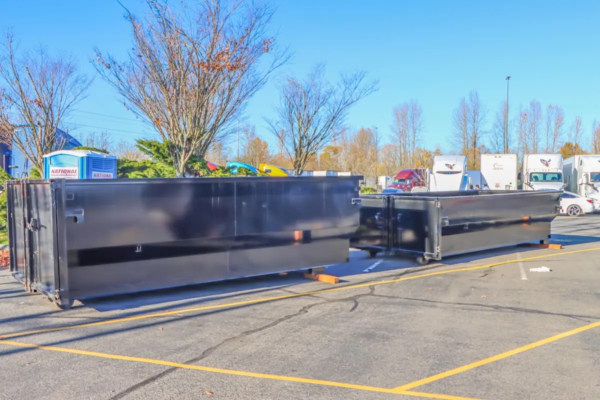 Professional dumpster rental service with roll-off container on residential driveway in Hilliard